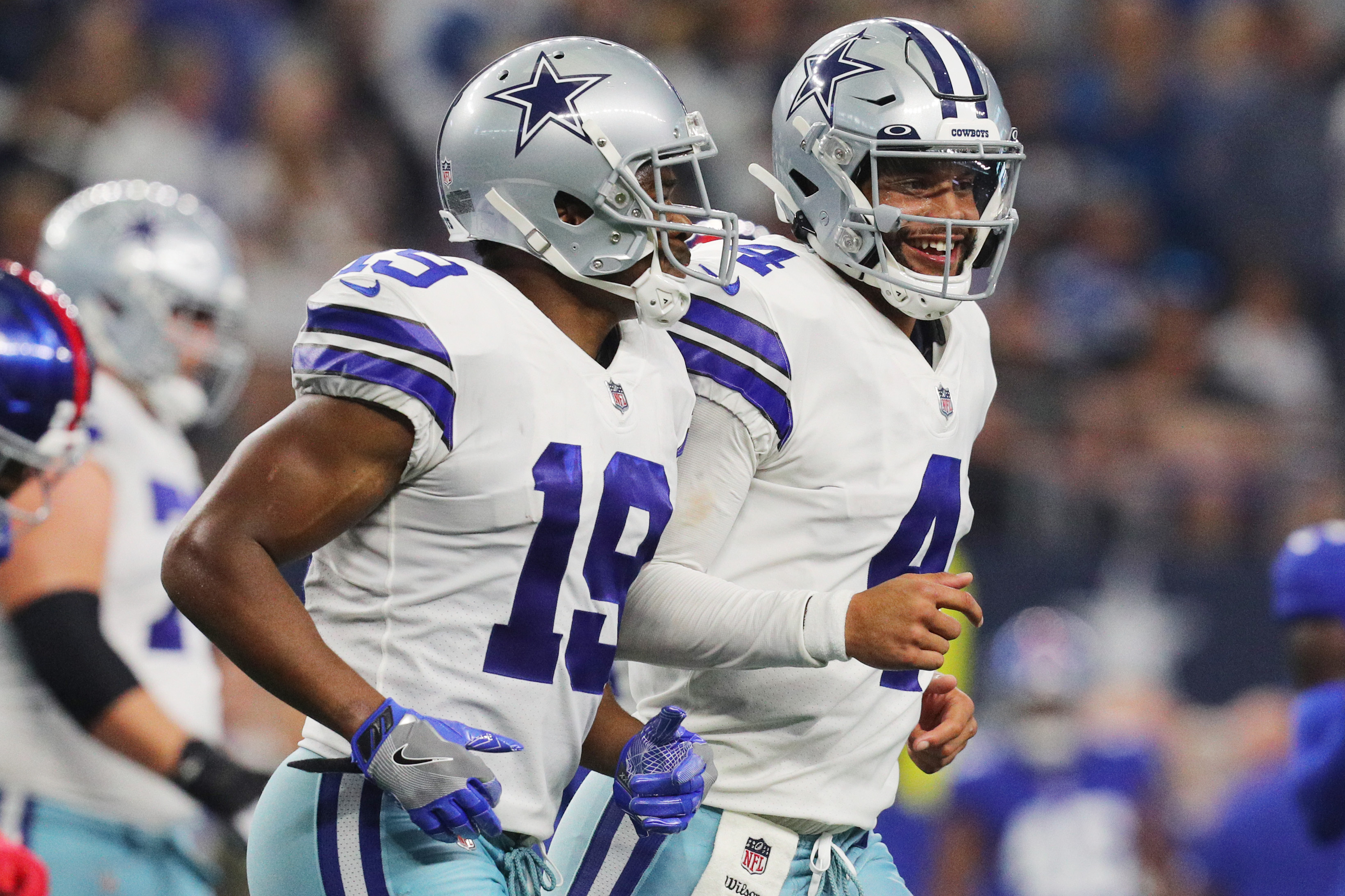 Dallas Cowboys WR Amari Coopers next to Dak Prescott.