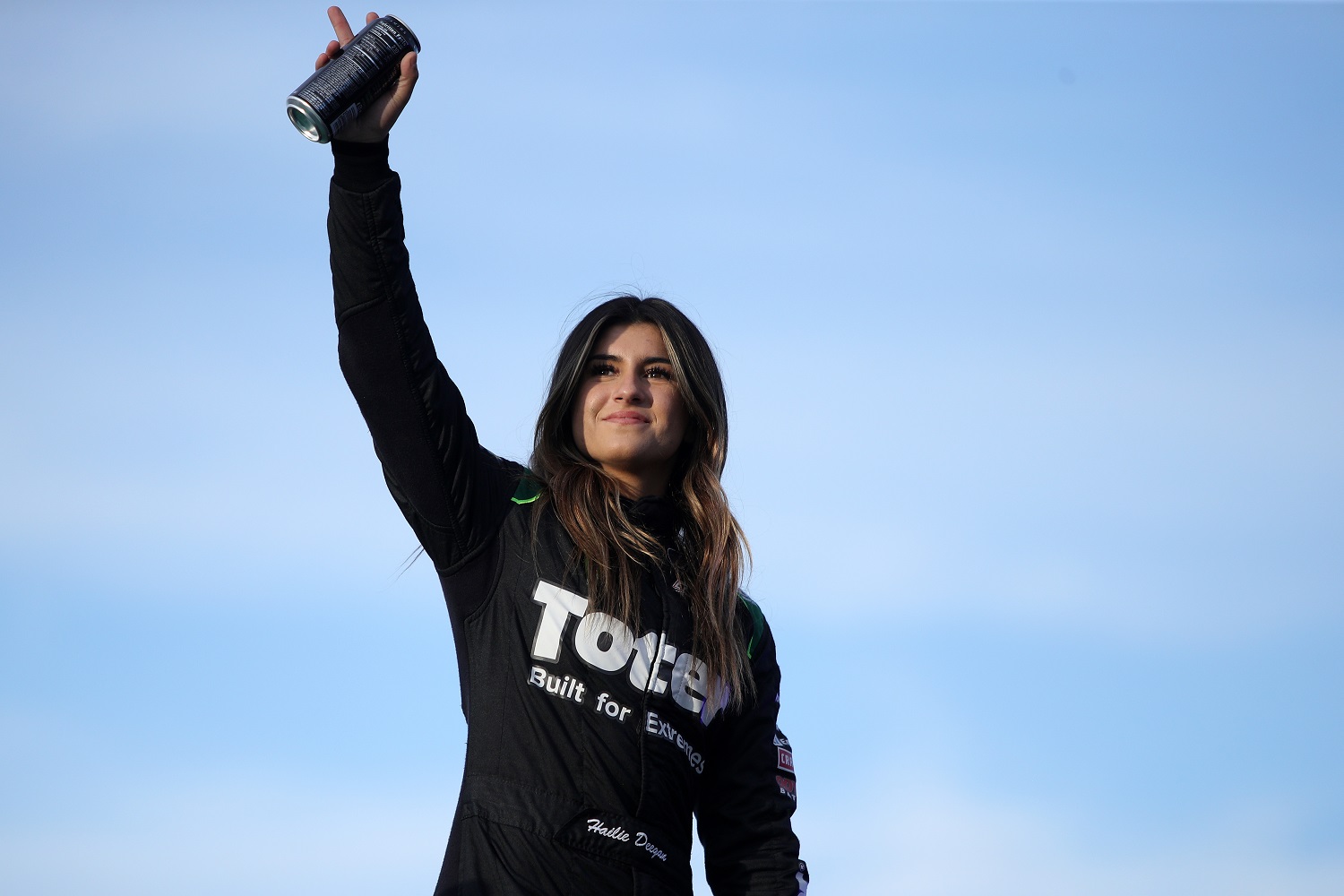 Hailie Deegan, driver of the No. 1 Ford, waves to fans prior to the NASCAR Camping World Truck Series Lucas Oil 150 at Phoenix Raceway on Nov. 5, 2021. | Sean Gardner/Getty Images