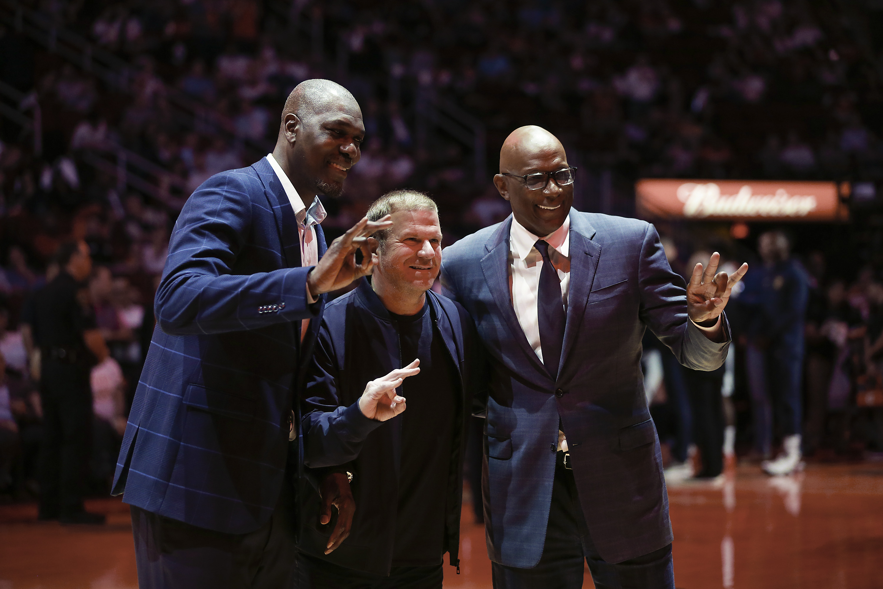 Hakeem Olajuwon (L) and Clyde Drexler (R) with Houston Rockets governor Tilman Fertitta in March 2019