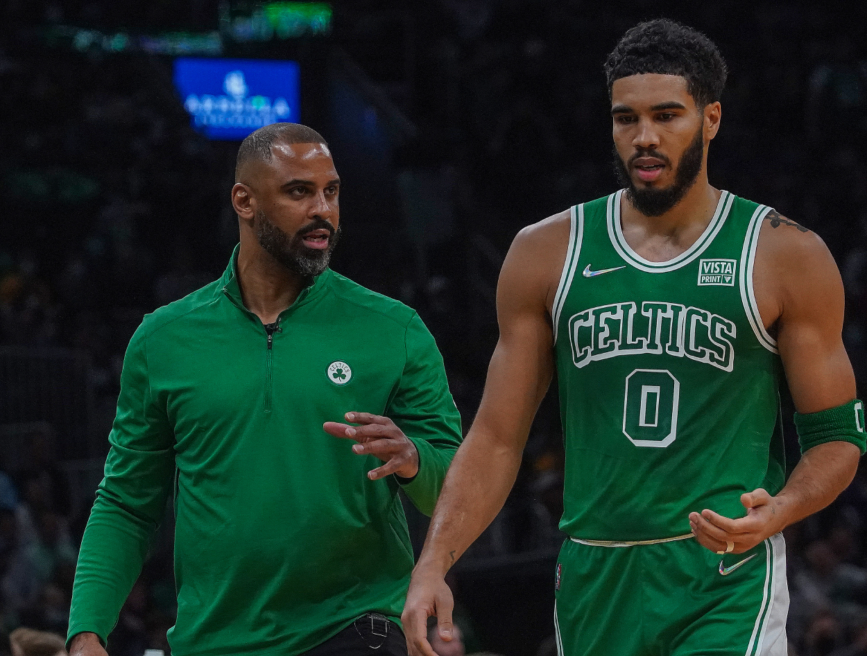 Boston Celtics head coach Ime Udoka and Boston Celtics forward Jayson Tatum chat during a timeout.