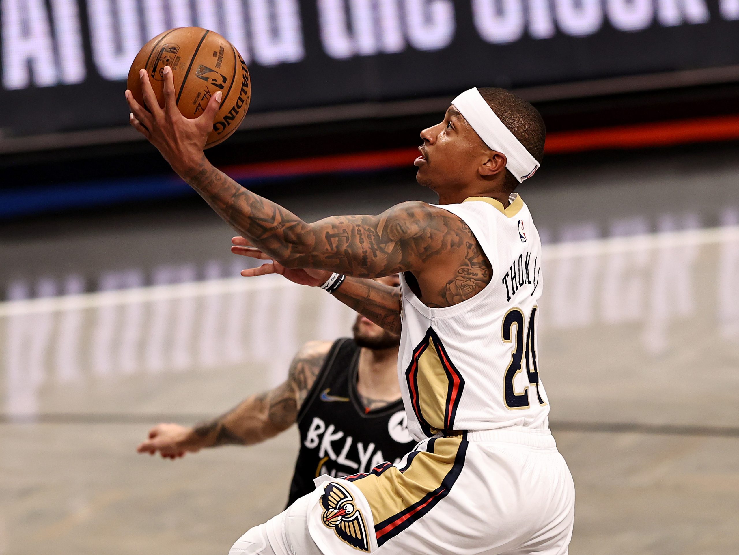 Isaiah Thomas of the New Orleans Pelicans drives to the basket.