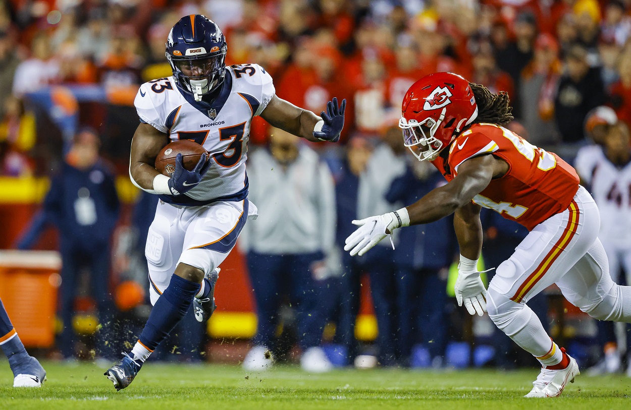 Javonte Williams runs the ball against the Kansas City Chiefs