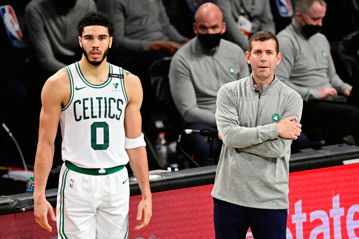 Jayson Tatum and Brad Stevens of the Boston Celtics look on against the Brooklyn Nets.