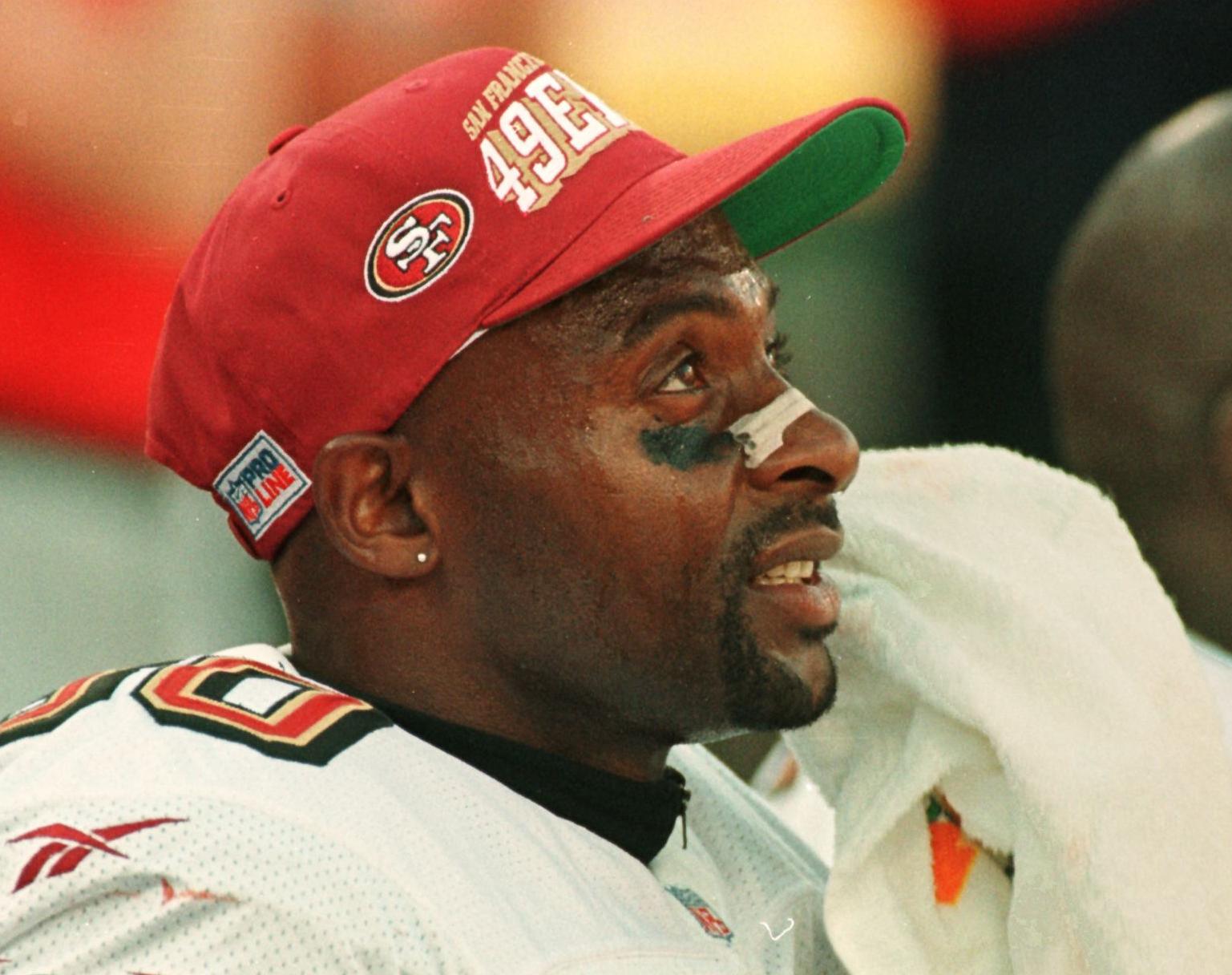 49ers wide receiver Jerry Rice sits on the sideline