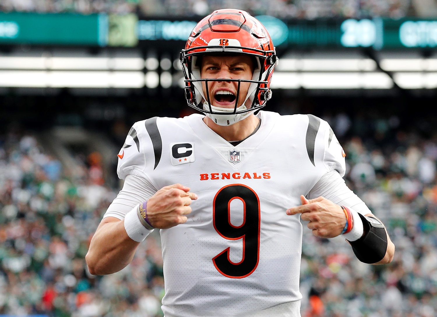 Cincinnati Bengals QB Joe Burrow celebrates scoring a touchdown against the New York Jets.