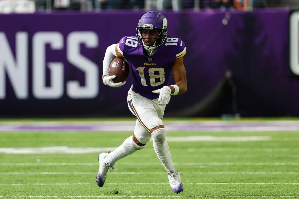 Justin Jefferson of the Minnesota Vikings runs with the ball.