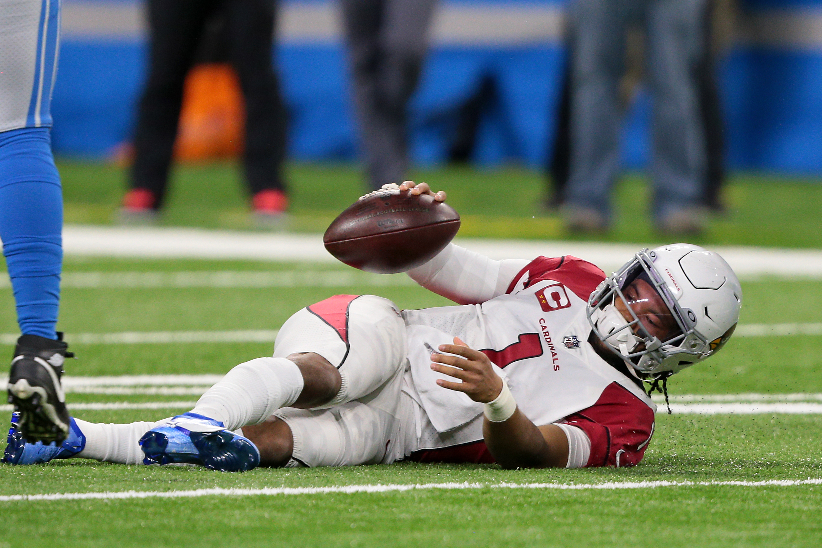 Cardinals QB Kyler Murray knocked to the ground by Lions defenders