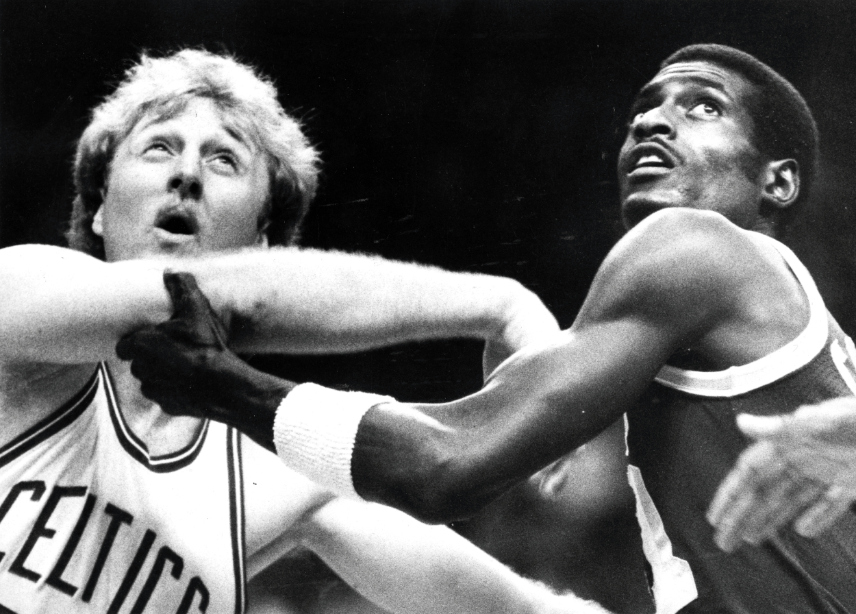 Boston Celtics' Larry Bird, left, and the Lakers' Michael Cooper are pictured during Game 2 of the 1984 NBA Finals.