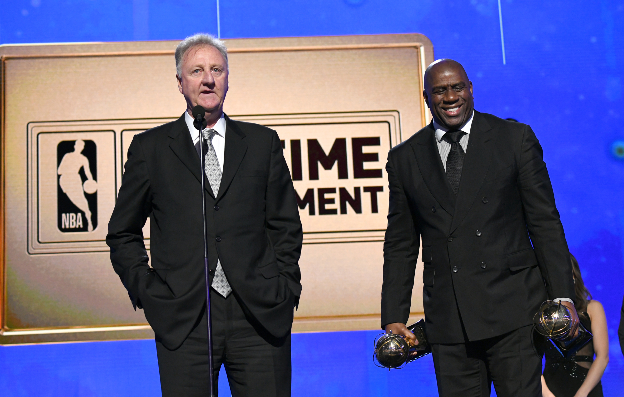 Larry Bird, left, and Magic Johnson accept the Lifetime Achievement Awards in 2019.