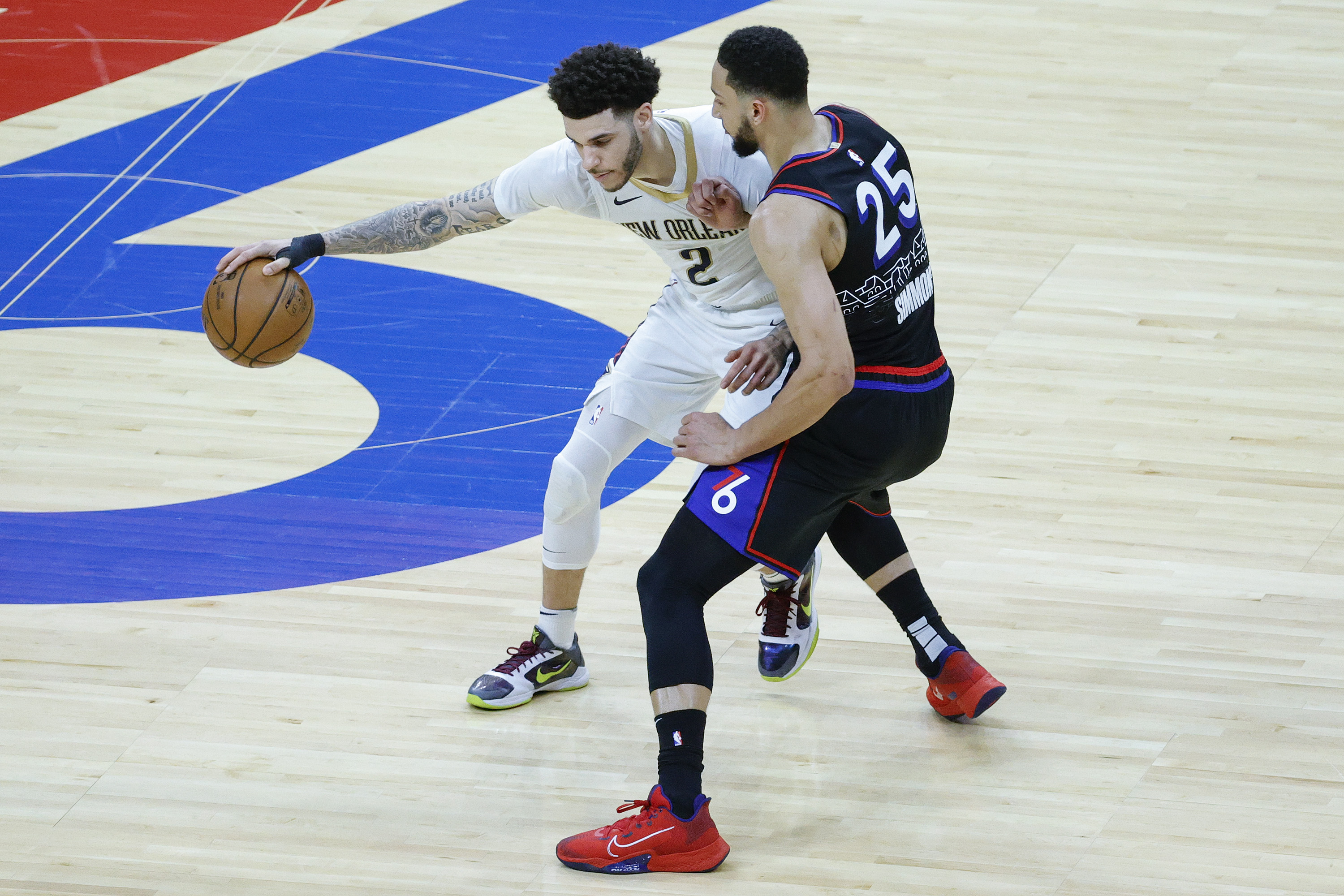 Philadelphia 76ers guard Ben Simmons defends former New Orleans Pelicans and current Chicago Bulls point guard Lonzo Ball during a game in May 2021