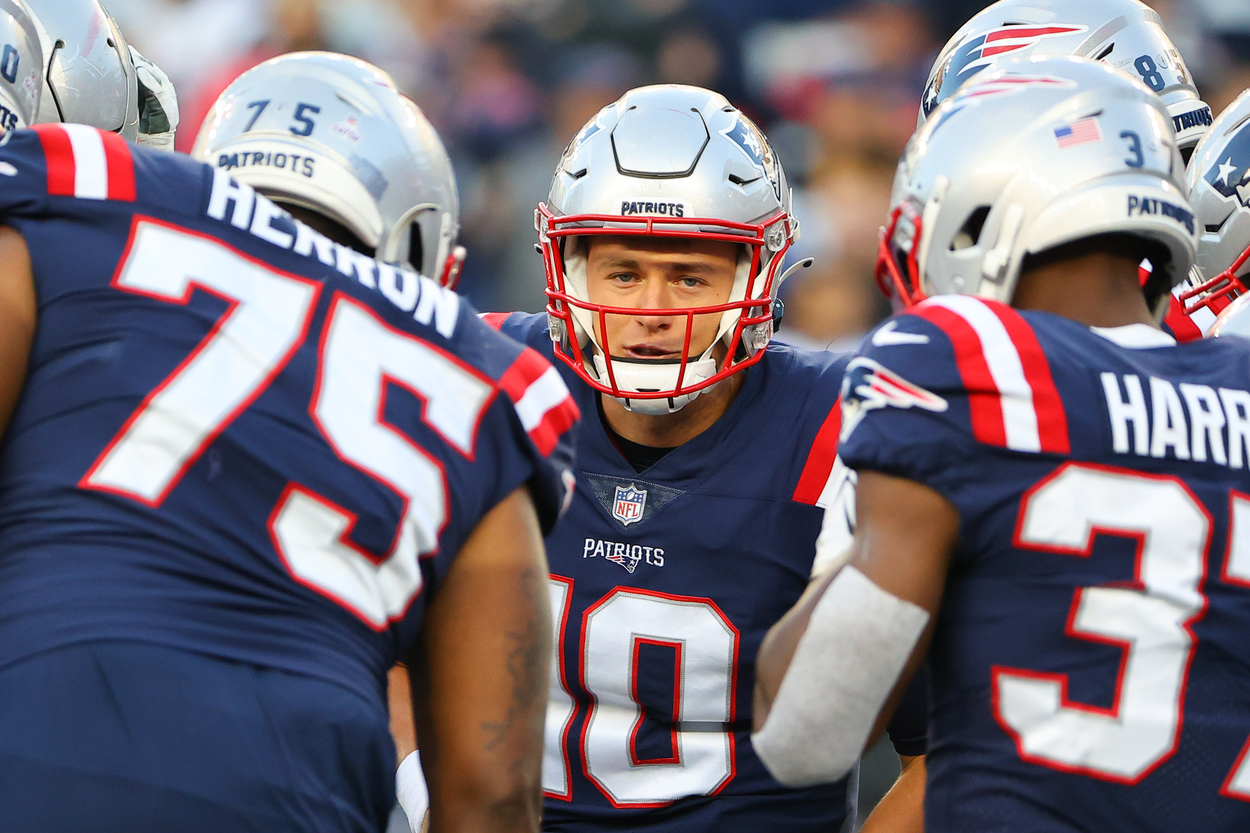 New England Patriots quarterback Mac Jones and teammates in 2021.