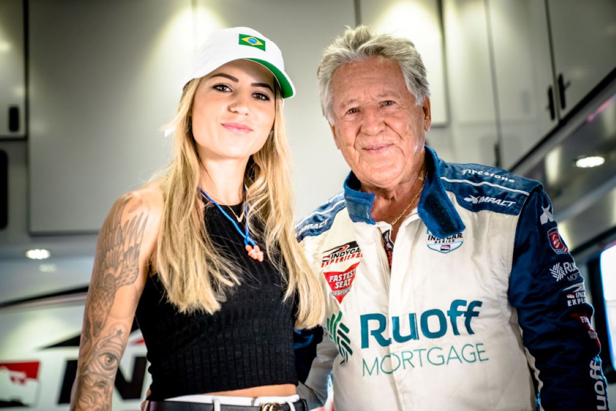 Former Formula 1 and NASCAR premier series driver Mario Andretti poses with X-Games gold medal-winning skateboarder Leticia Bufoni at the 2021 Acura Grand Prix of Long Beach on Sept. 25, 2021, in Long Beach, California