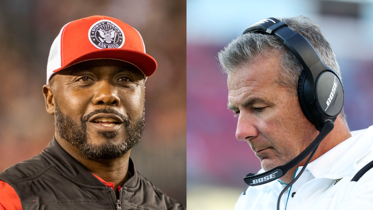Marshall Faulk on sideline during college football game; Former Jaguars Urban Meyer looks down during a game