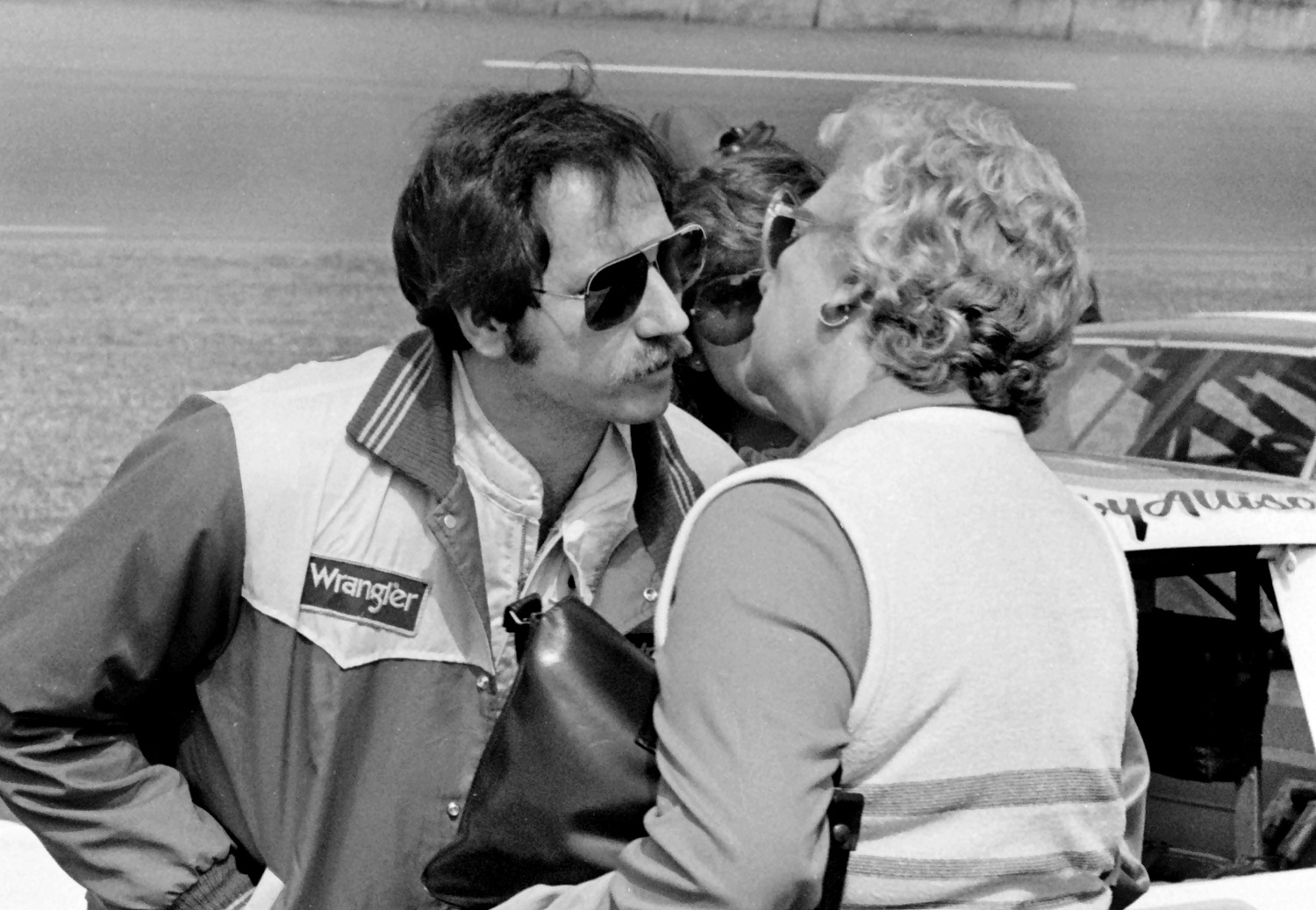 NASCAR driver Dale Earnhardt Sr. kisses his mother, Martha Earnhardt, before the start of the 1981 Daytona 500 at Daytona International Speedway.