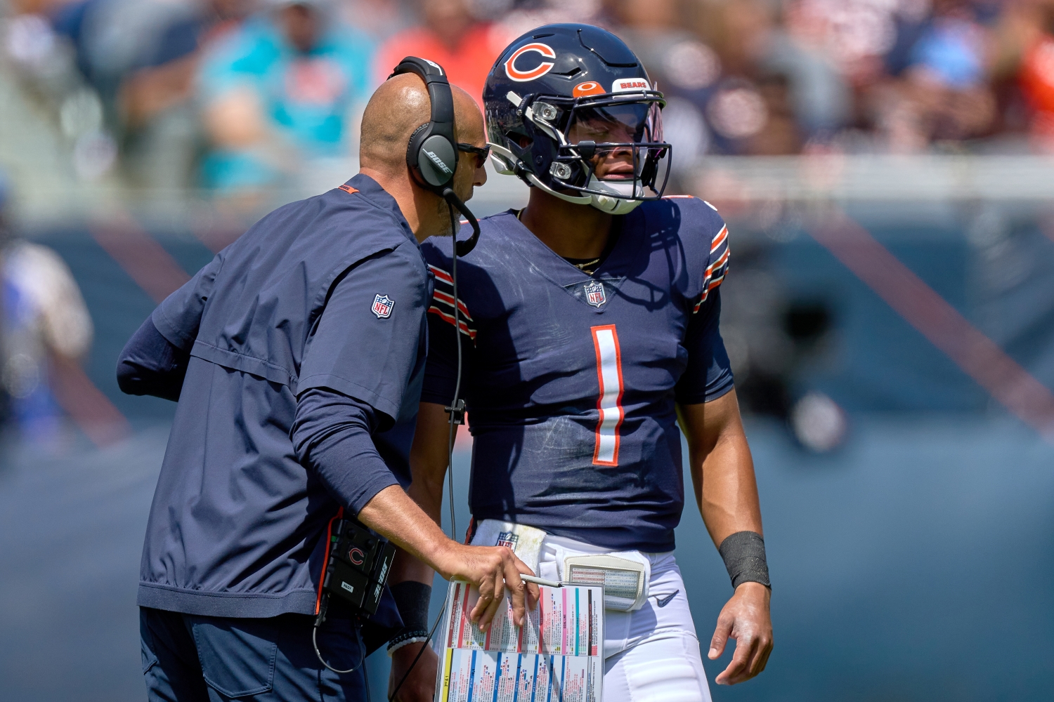 Chicago Bears head coach Matt Nagy speaks to quarterback Justin Fields before a play.