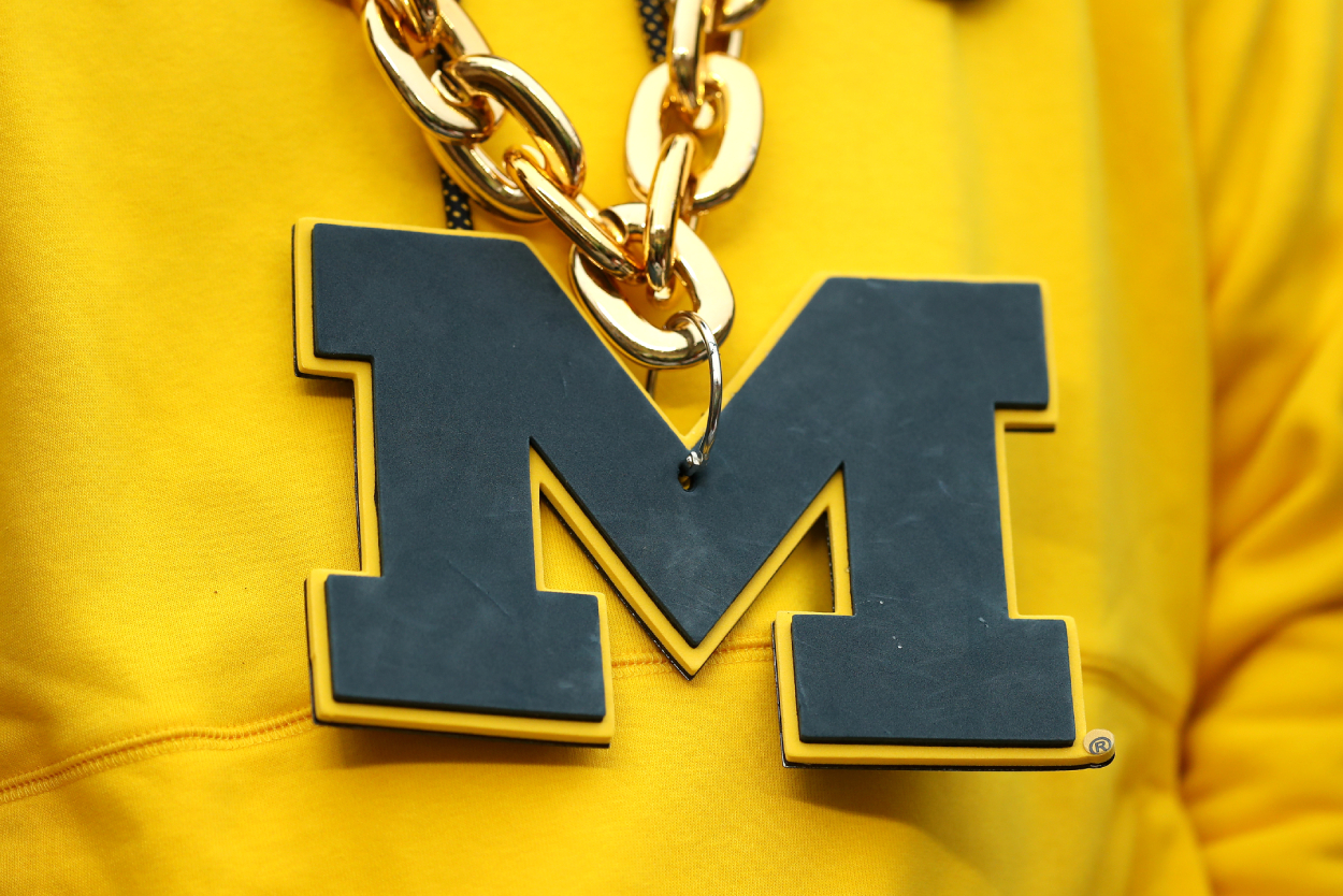 Detail of a Michigan Wolverines necklace.
