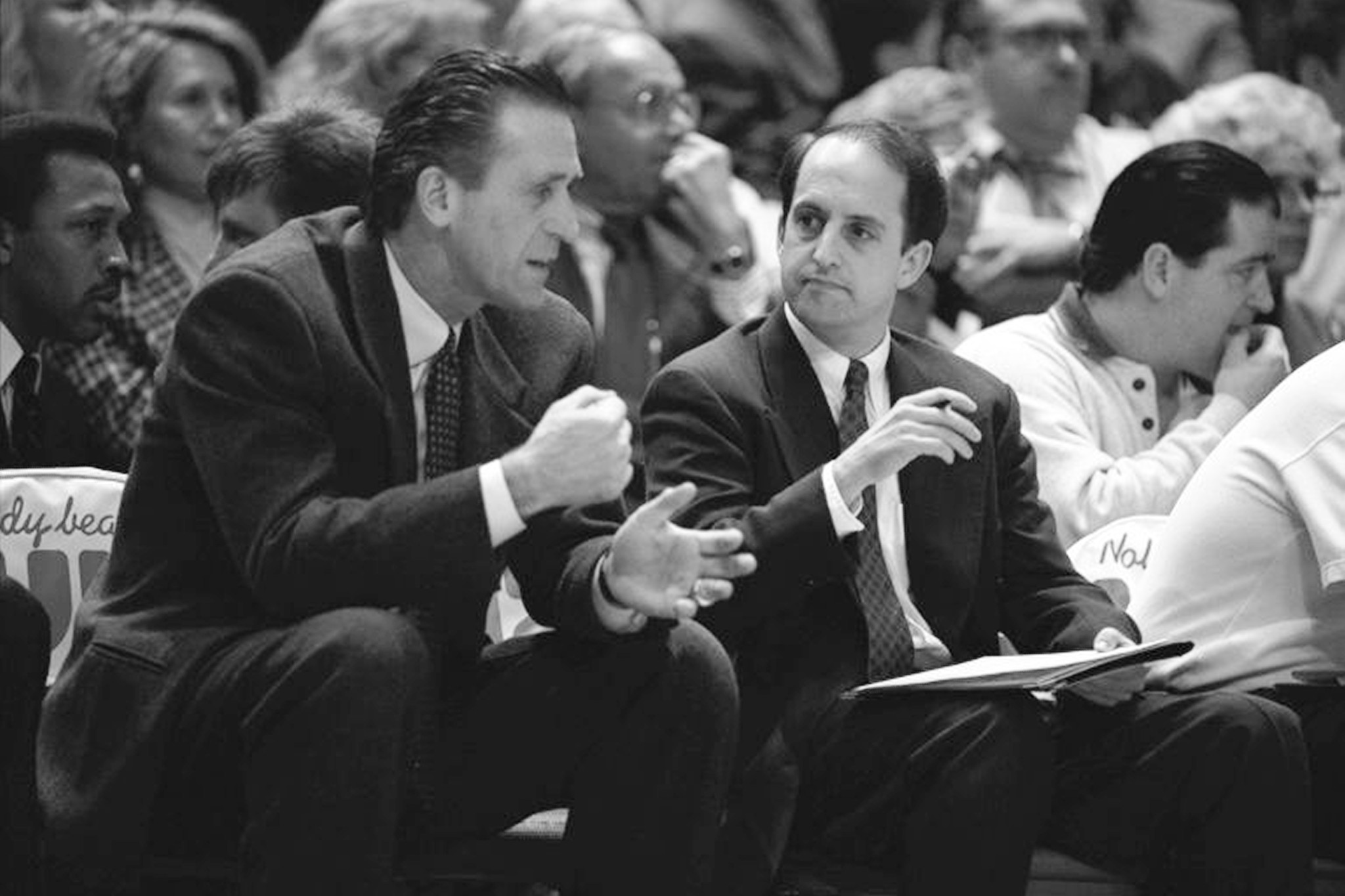 Former New York Knicks head coach Pat Riley talks with then-assistant Jeff Van Gundy