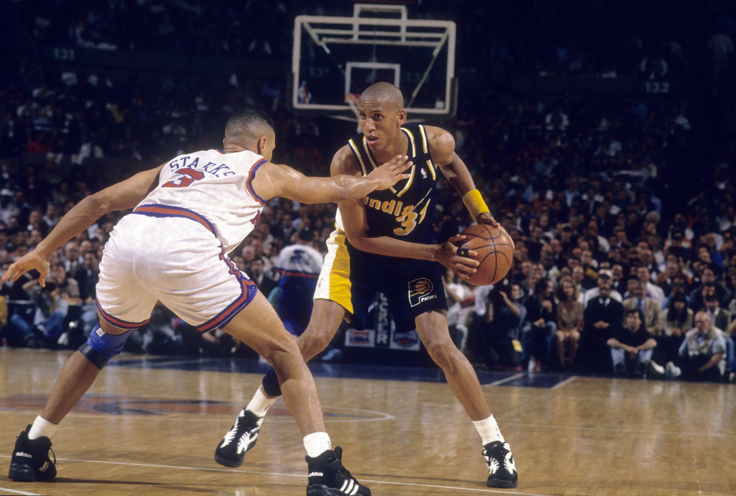 Reggie Miller of the Indiana Pacers is guarded closely by John Starks of the New York Knicks.