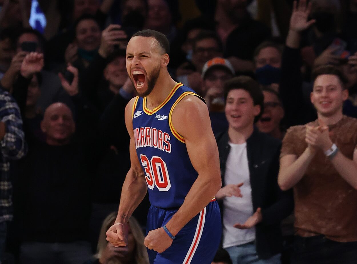 Stephen Curry #30 of the Golden State Warriors celebrates after making a three point basket to break Ray Allen’s record for the most all-time against the New York Knicks during their game at Madison Square Garden on December 14, 2021