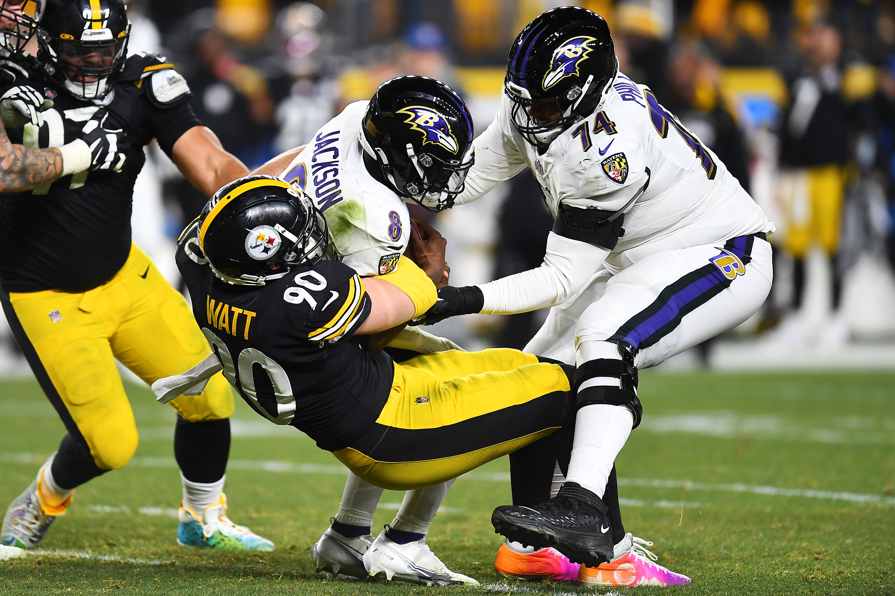 Pittsburgh Steelers defensive end T.J. Watt sacks Lamar Jackson