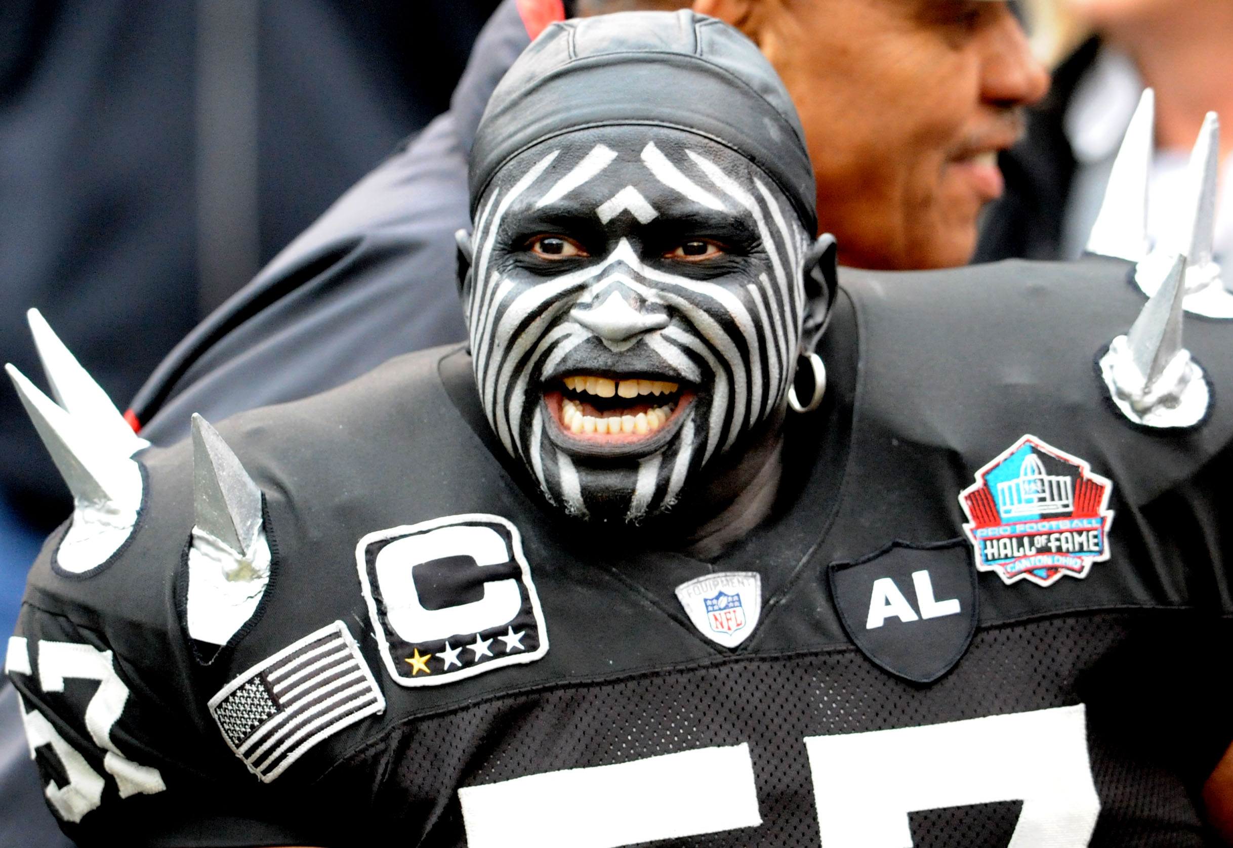 Raiders fan Wayne Mabry, also known as the "Violator," cheers for his team.