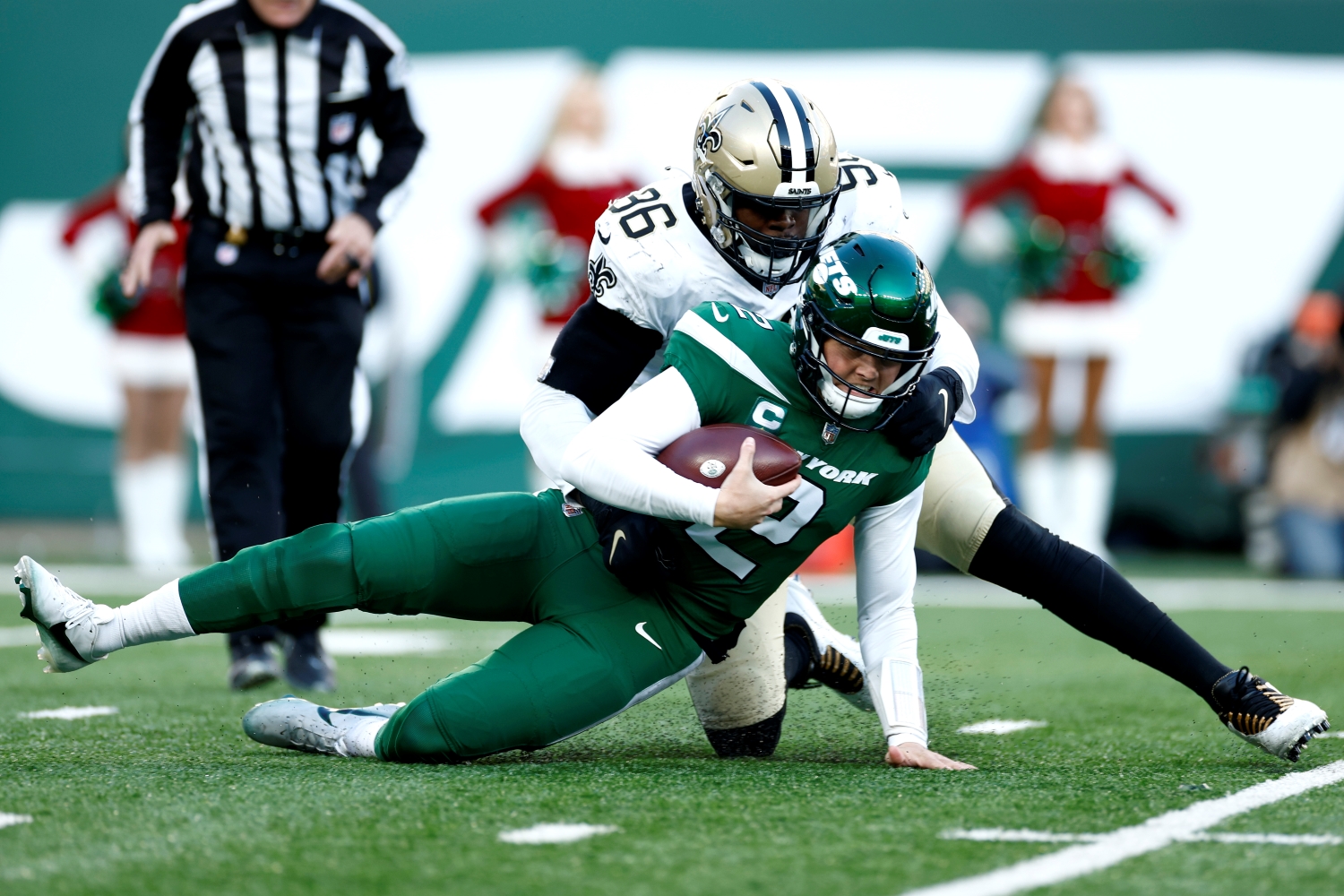 Jets QB Zach Wilson gets sacked by a New Orleans Saints defender.