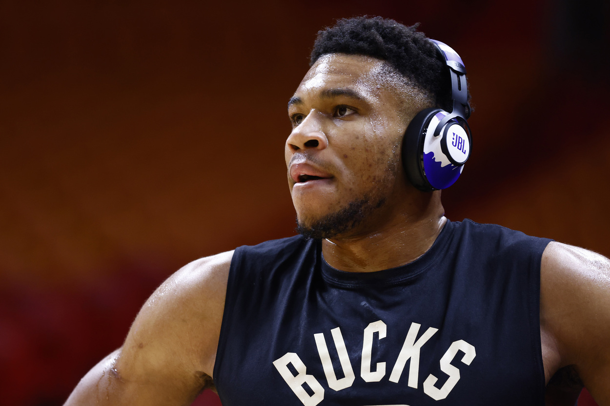 Milwaukee Bucks star Giannis Antetokounmpo listens to music during warmups.