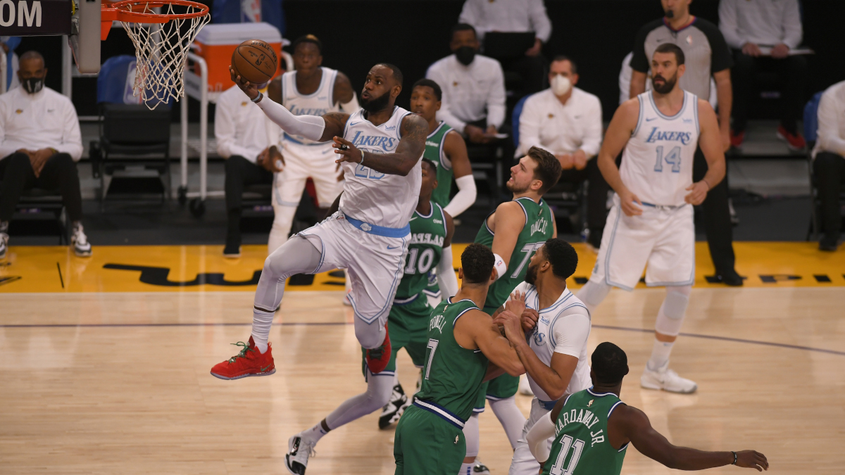 LeBron James glides past the Dallas Mavericks defense for a basket during a Christmas Day game in 2020.