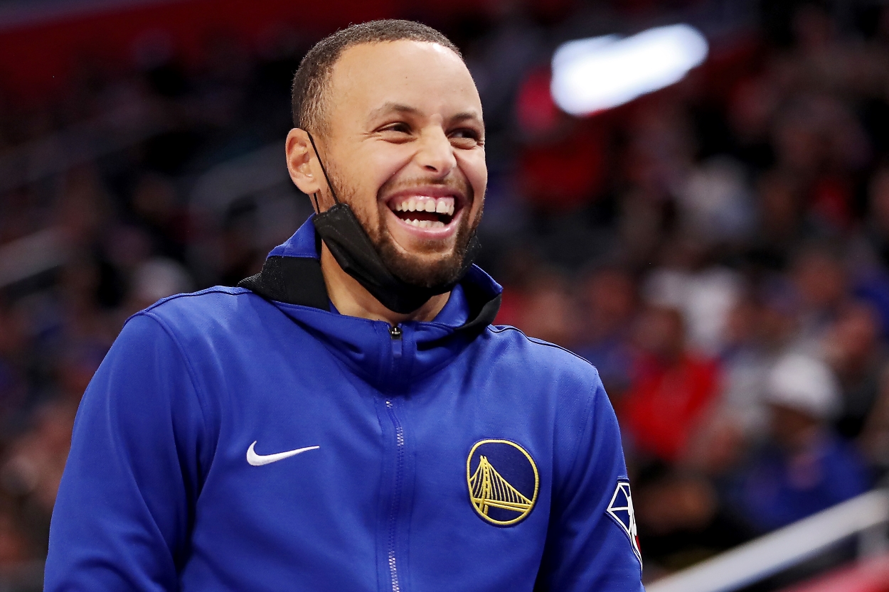 Stephen Curry of the Golden State Warriors laughs during a game as he closes in on the NBA's all-time made 3-pointers record.