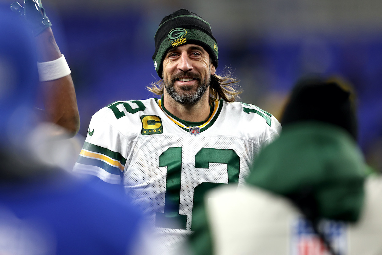 Aaron Rodgers of the Green Bay Packers smiles as he walks off the field after their game against the Baltimore Ravens at M&T Bank Stadium on December 19, 2021 in Baltimore, Maryland.
