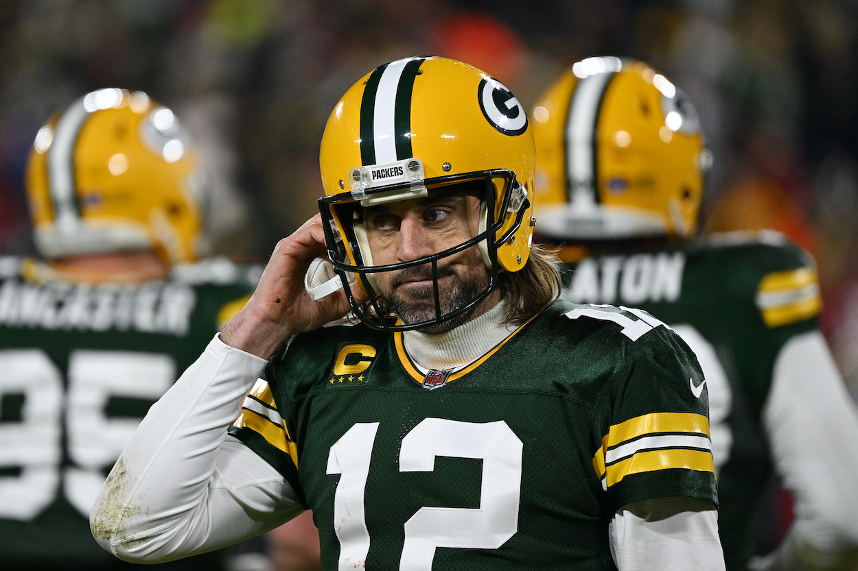 Quarterback Aaron Rodgers of the Green Bay Packers reacts after failing to get a first down during the 2nd quarter of the NFC Divisional Playoff game against the San Francisco 49ers at Lambeau Field on January 22, 2022 in Green Bay, Wisconsin.
