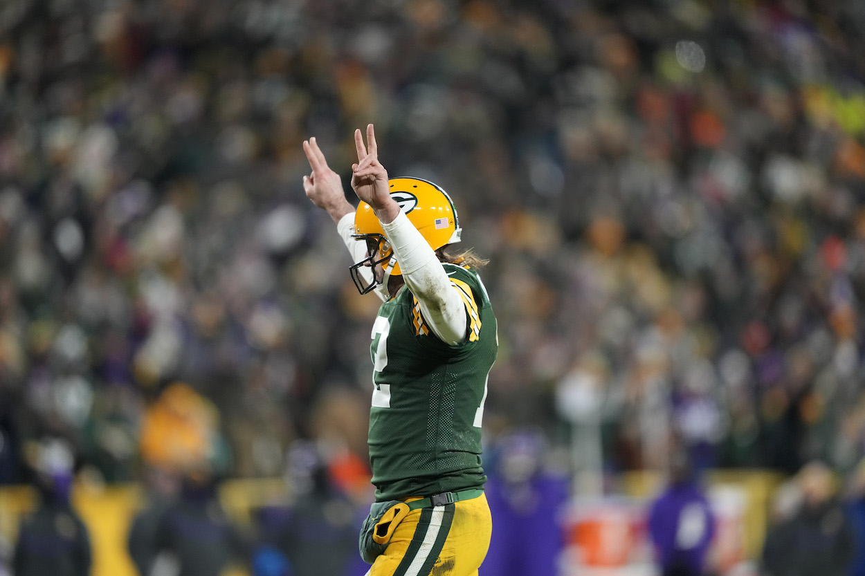 Quarterback Aaron Rodgers of the Green Bay Packers celebrates after a touchdown during the 3rd quarter of the game against the Minnesota Vikings at Lambeau Field on January 02, 2022 in Green Bay, Wisconsin.