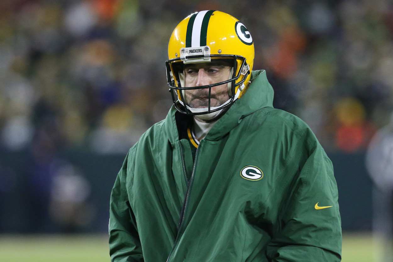 Green Bay Packers quarterback Aaron Rodgers keeps warm during a time out during the NFC Divisional playoff game between the Green Bay Packers and the San Francisco 49ers at Lambeau Field on January 22, 2022, in Green Bay, WI.