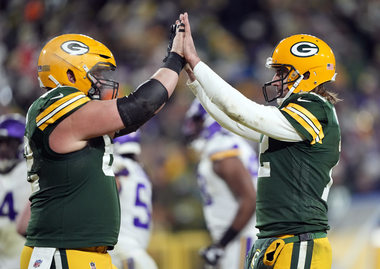 Green Bay Packers quarterback Aaron Rodgers (R) and center Lucas Patrick in 2022.