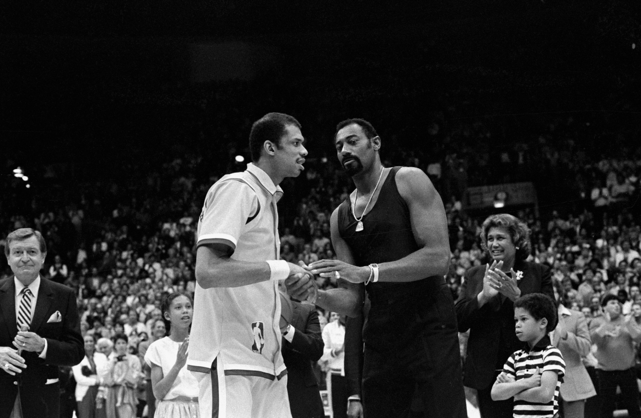 Los Angeles Lakers center Kareem Abdul-Jabbar (L) is congratulated by Wilt Chamberlain.