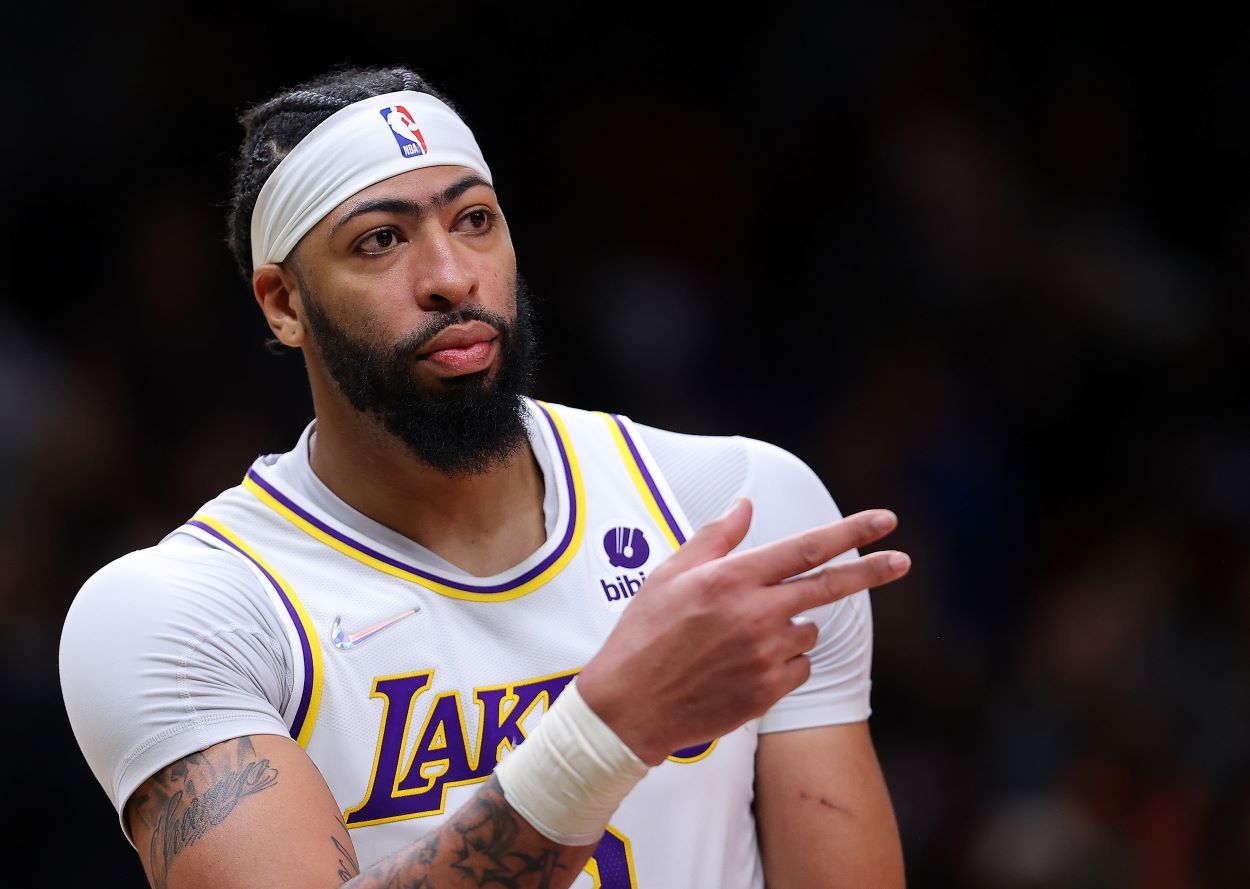 Lakers forward Anthony Davis reacts to a play during an NBA game.