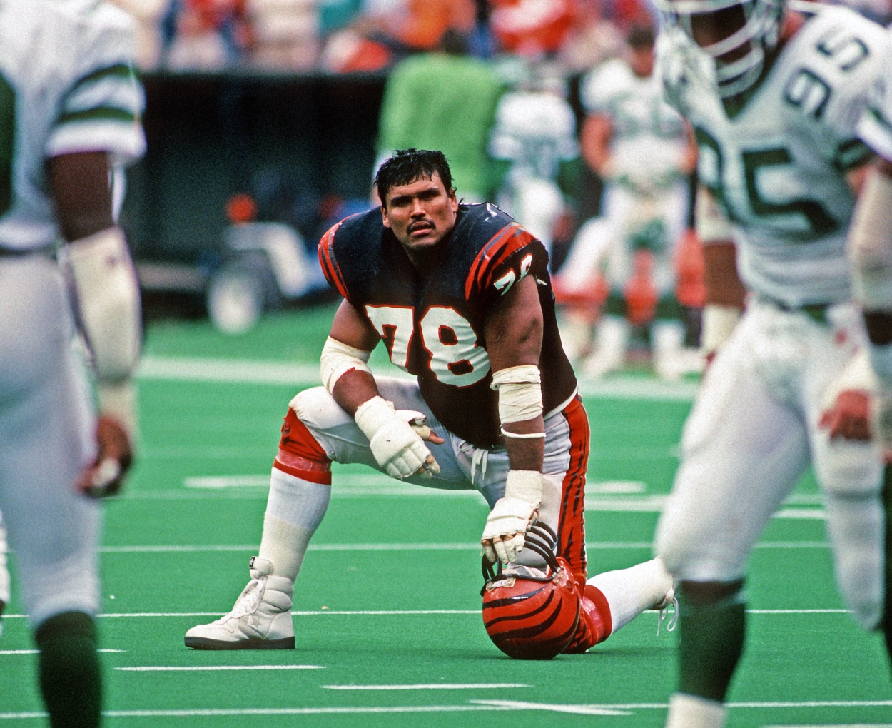 Offensive lineman Anthony Munoz of the Cincinnati Bengals looks on from the field.