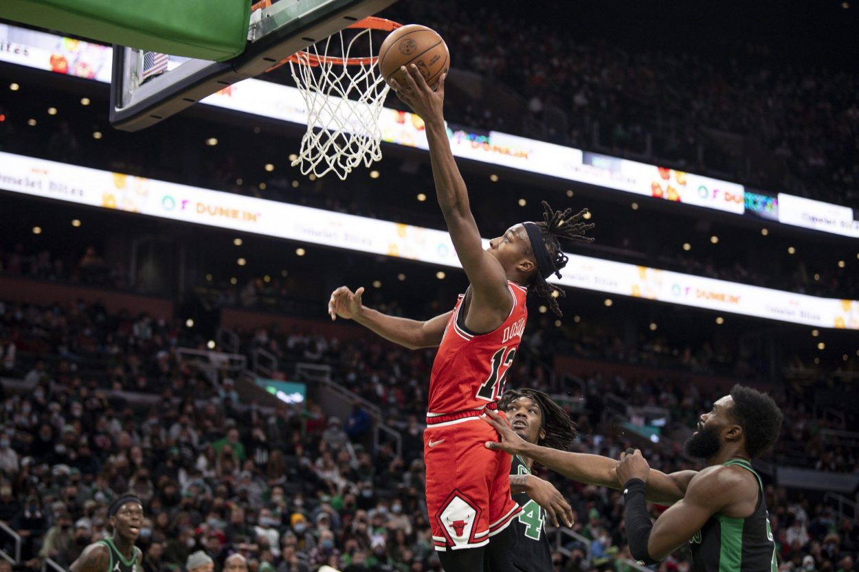 Chicago Bulls rookie Ayo Dosunmu lays the ball up during a game against the Boston Celtics