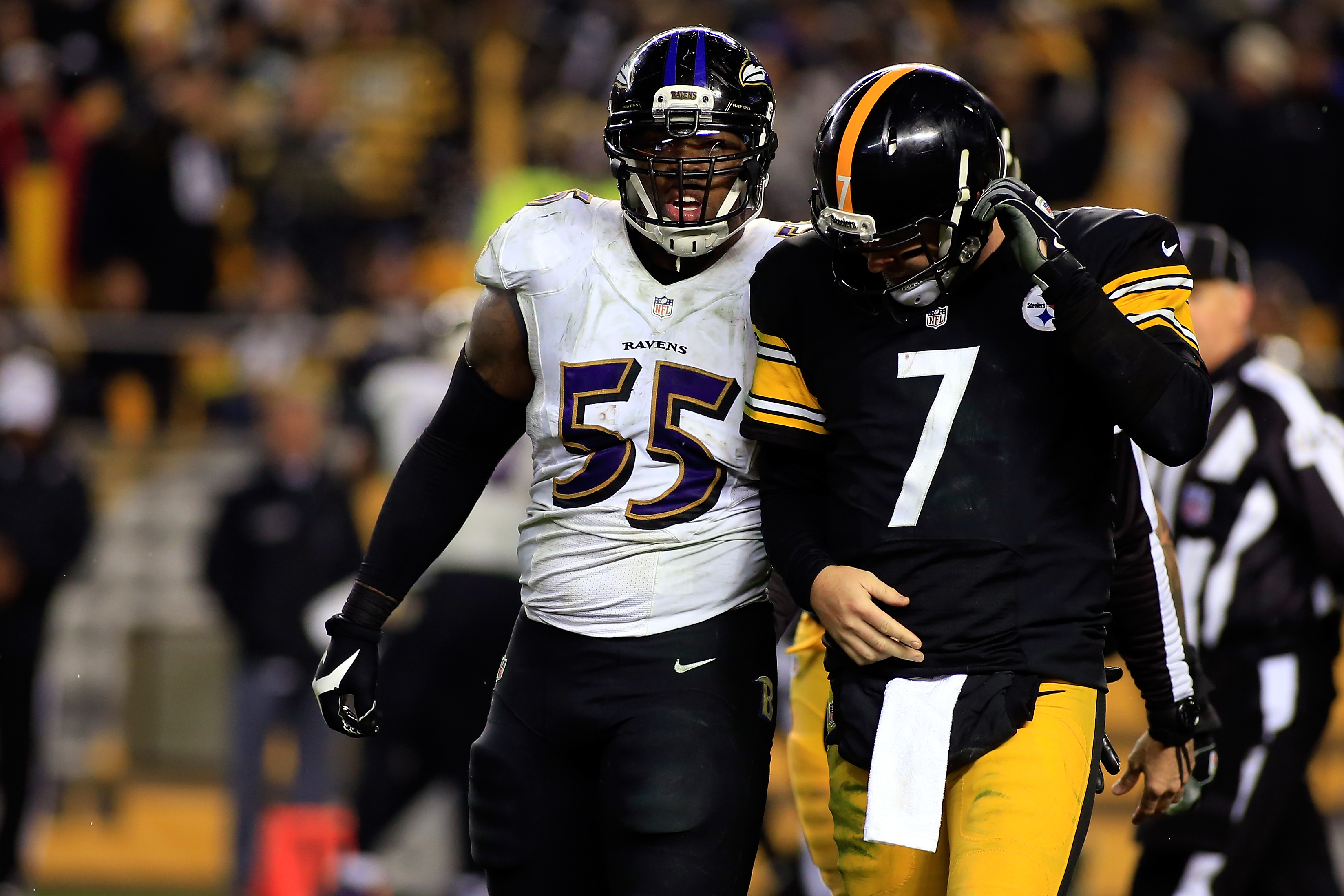 Ravens LB Terrell Suggs talks to Steelers QB Ben Roethlisberger during a game