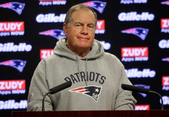 New England Patriots head coach Bill Belichick at the podium.