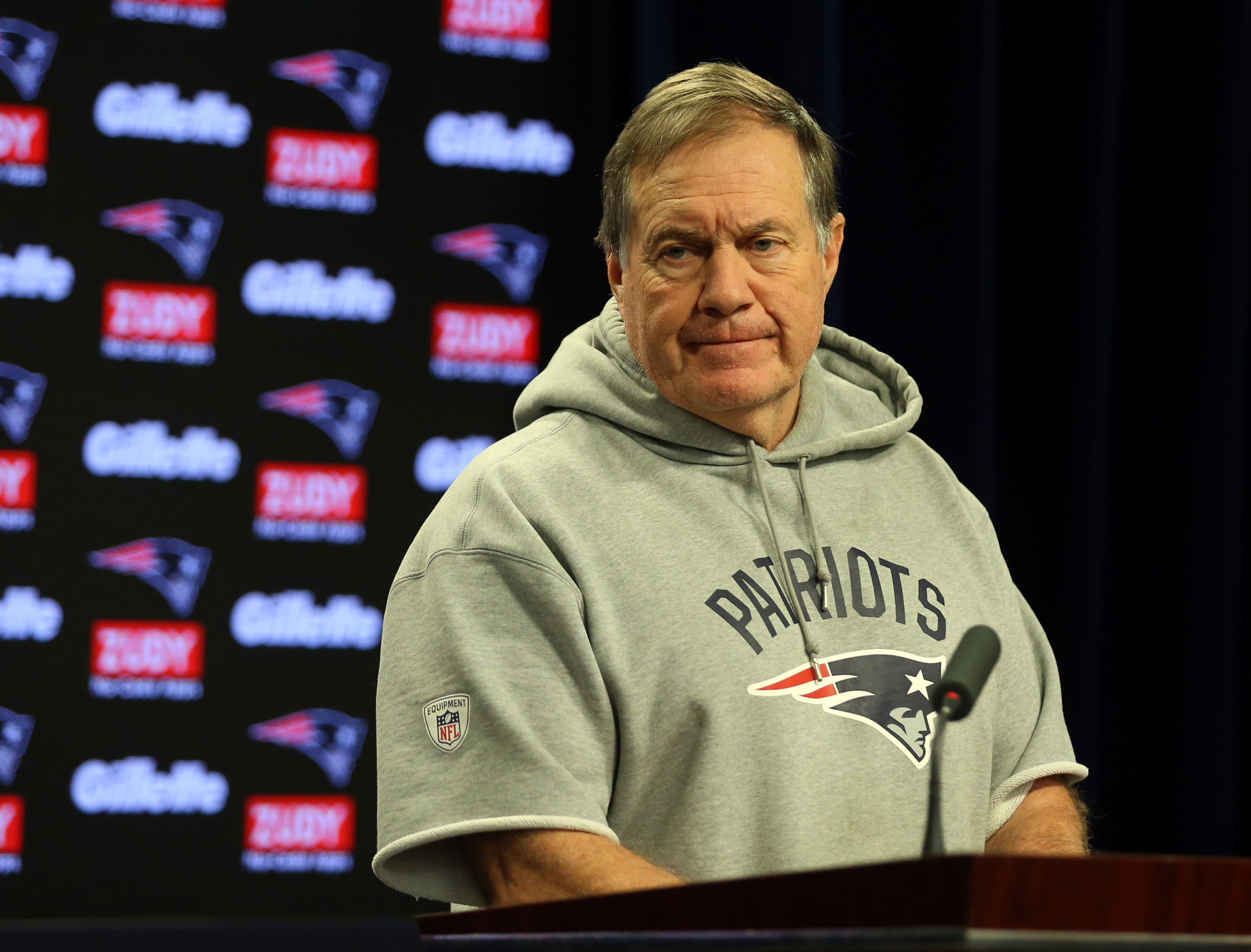 New England Patriots coach Bill Belichick talks with reporters.
