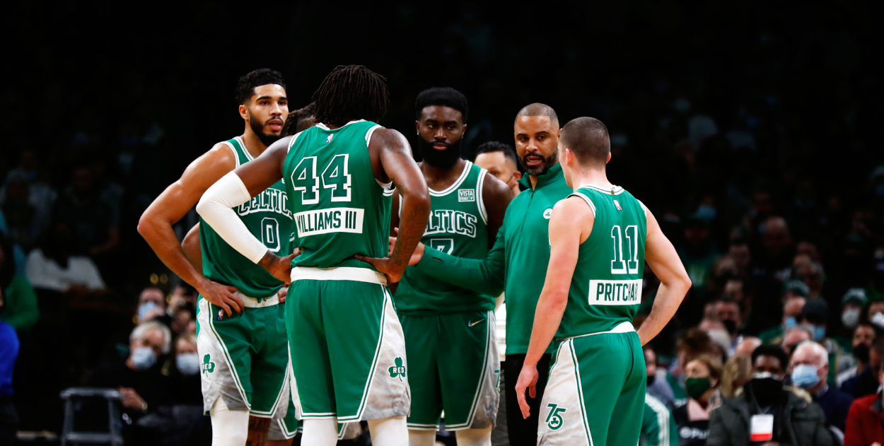 Head coach Ime Udoka (second right) talks with Payton Pritchard (R), Jaylen Brown (C), Robert Williams III , and Jayson Tatum of the Boston Celtics.