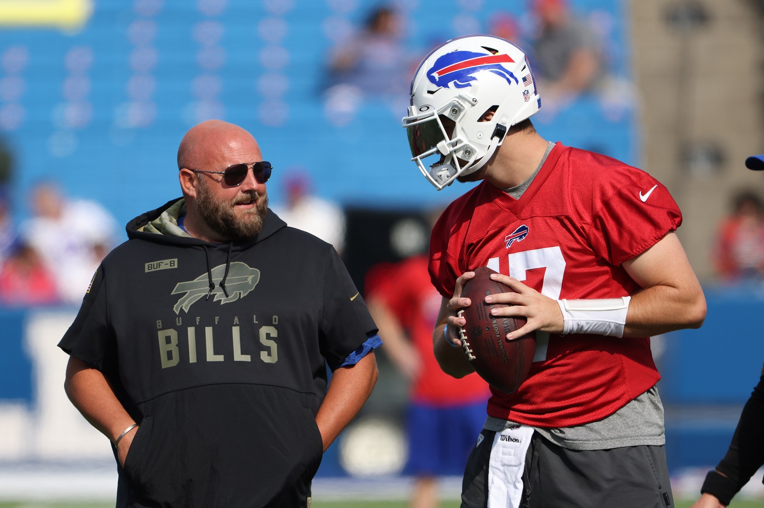 Buffalo Bills offensive coordinator Brian Daboll talks to Josh Allen on the field during training camp at Highmark Stadium on July 31, 2021 in Orchard Park, New York.