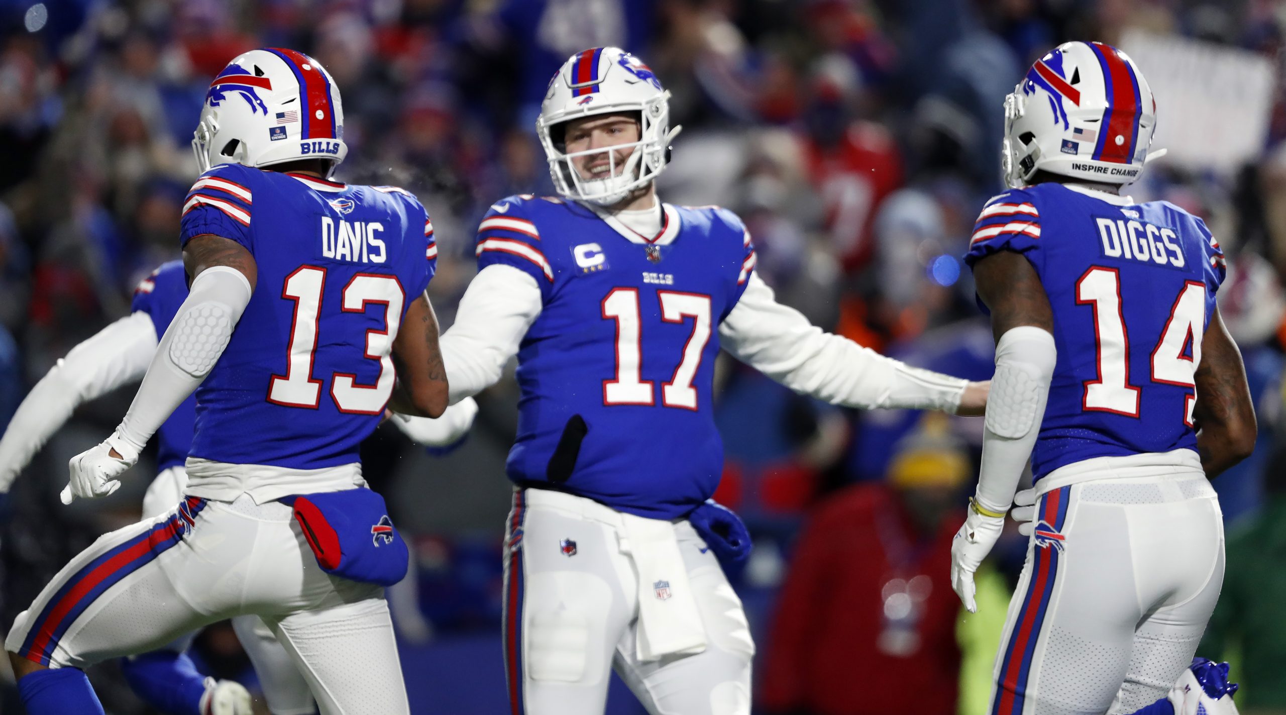 Buffalo Bills quarterback Josh Allen celebrates a touchdown with wide receivers Gabriel Davis and Stefon Diggs. The Buffalo Bills now play the Kansas City Chiefs in a AFC Divisional Round playoff game on January 23, 2022.