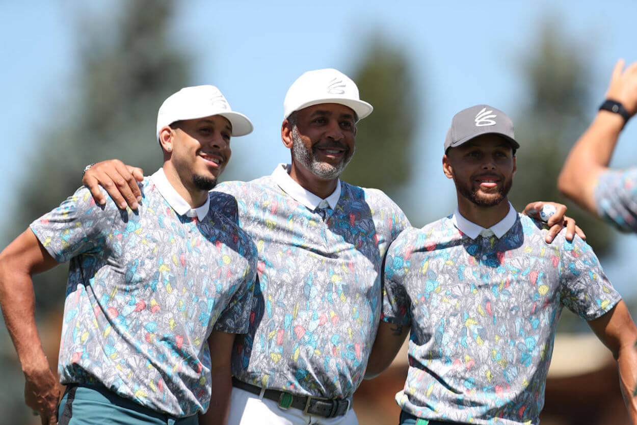 Seth Curry (L), Dell Curry (C), and Stephen Curry (R) on the golf course.