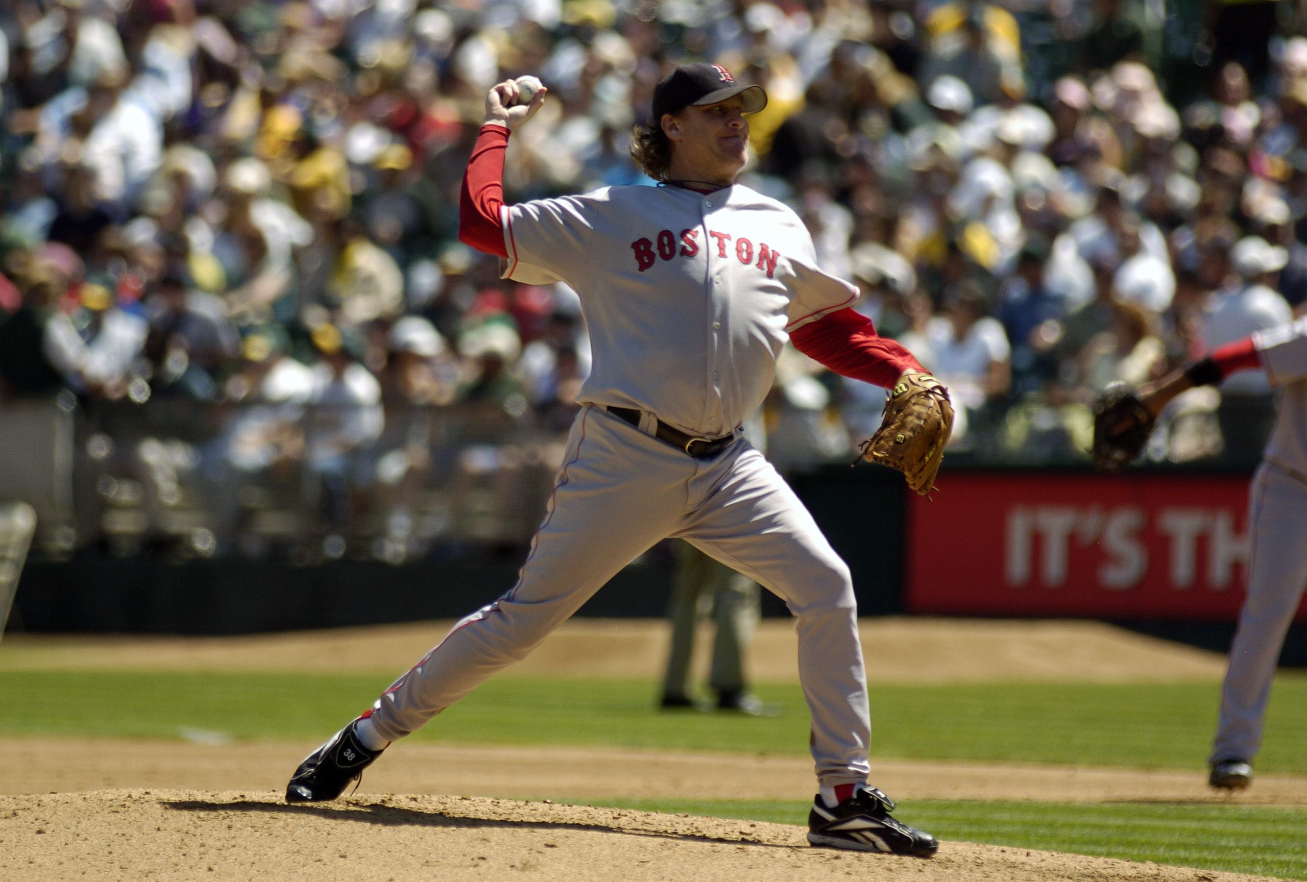 Curt Schilling of the Boston Red Sox pitches against the Oakland Athletics .