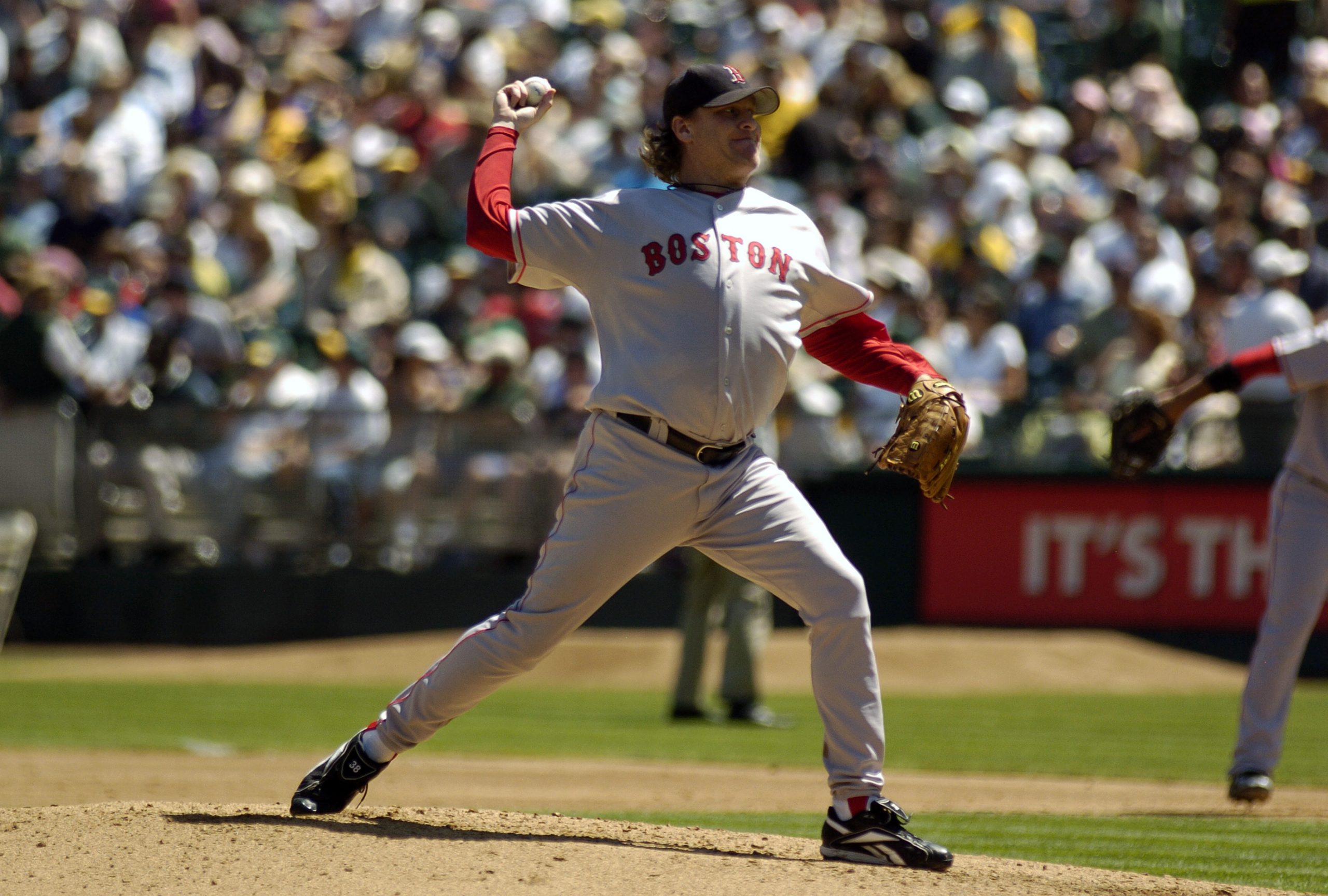 Curt Schilling of the Boston Red Sox pitches against the Oakland Athletics .