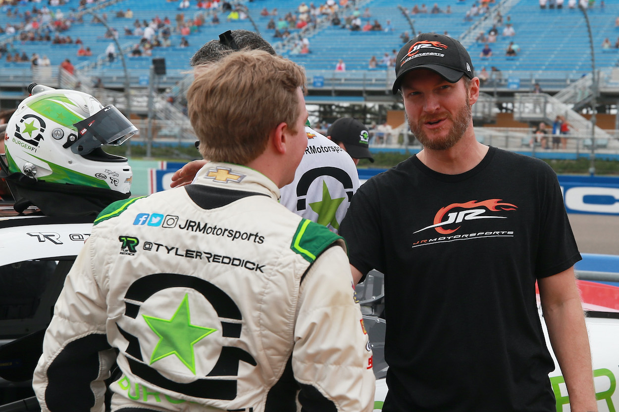 Dale Earnhardt Jr. talks with Tyler Reddick