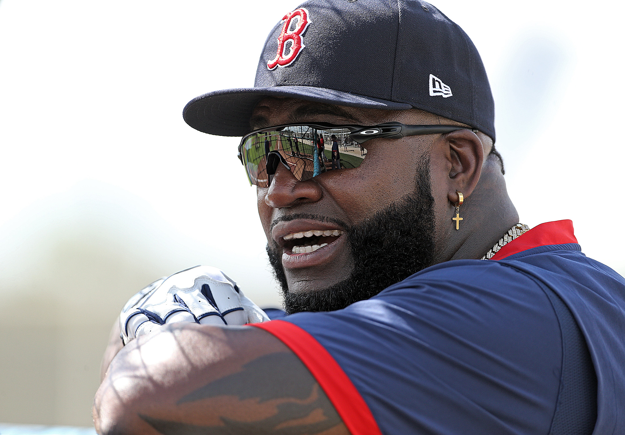 Former Red Sox great David Ortiz leans on the batting cage.