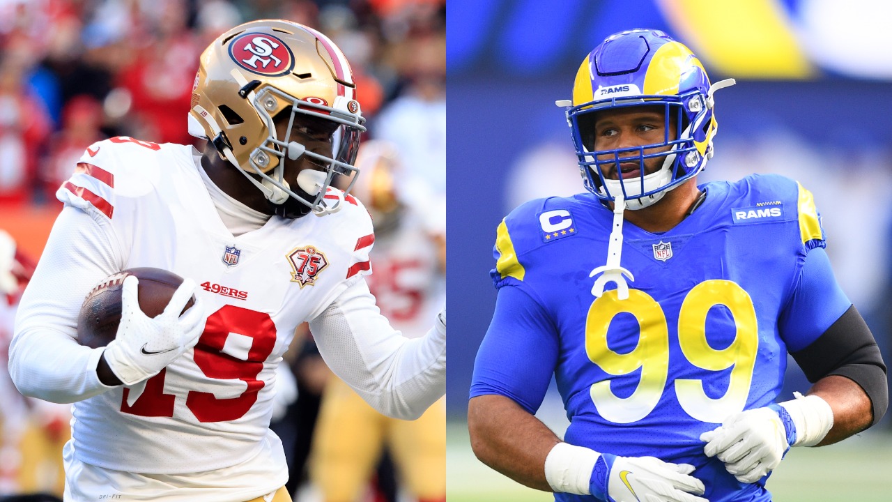 49ers WR Deebo Samuel in action against the Bengals; Rams DT Aaron Donald looks on during a game